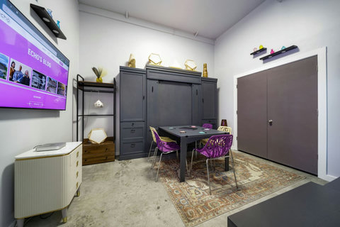 Bedroom with a Murphy bed and game table