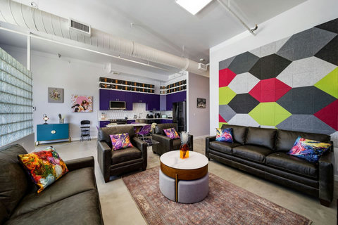 Leather sofas and colorful accent walls