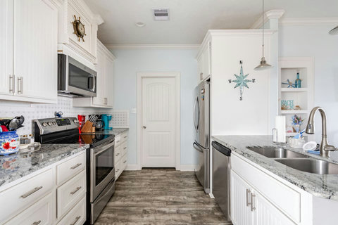 Galley-style kitchen with stainless appliances