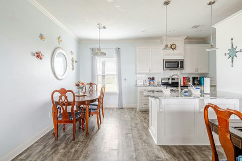 Dining table for six right next to the kitchen