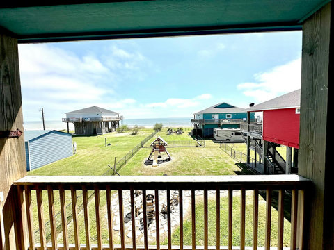 View of the yard and fire pit from the deck