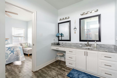 Primary bath with a long vanity and makeup counter