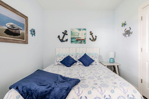 King bed with soft blue throws