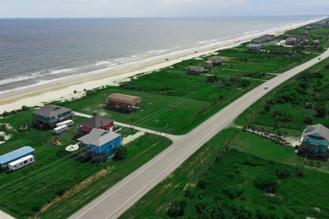 Aerial view of the beach and quiet road