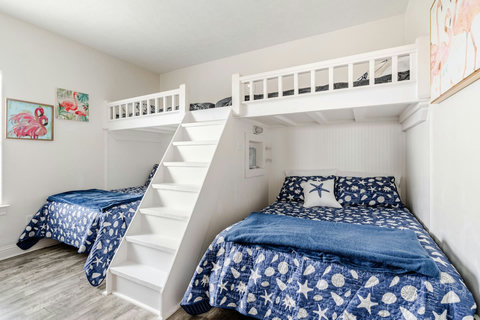 Bunk room with two twin-over-full bunks, a kid favorite