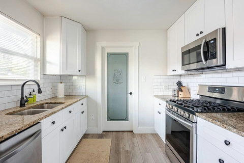 Kitchen with a frosted pantry door