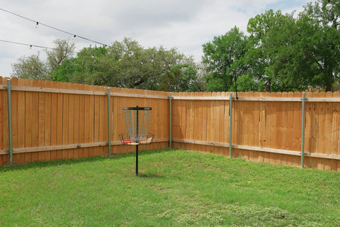 Disc golf basket in the backyard