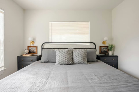 King bedroom with soft gray bedding