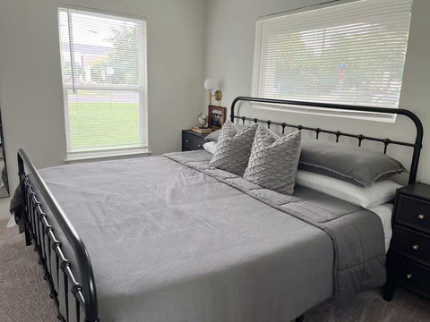 King bedroom with sunny windows