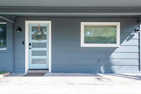 Front door with a wreath
