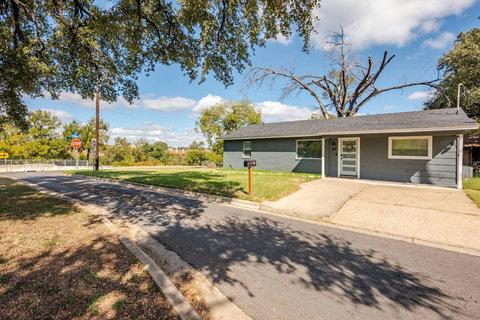 Street view with oak trees out front