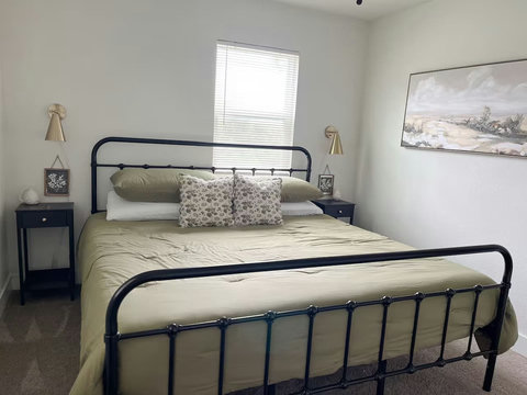Bedroom with an olive comforter