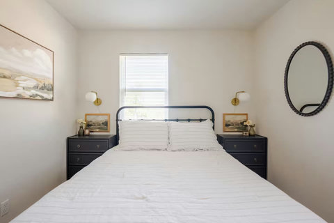 Queen bedroom with a mirror