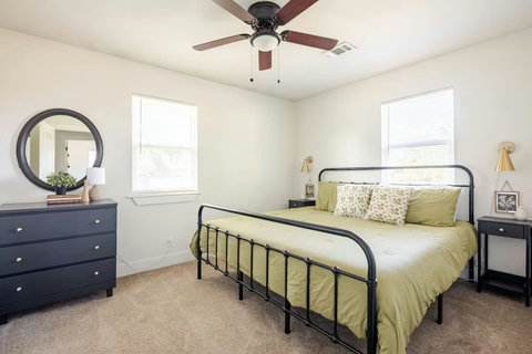 Bedroom with a dresser and mirror
