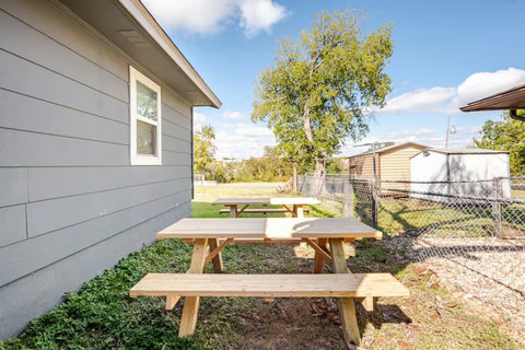 Picnic tables by the house