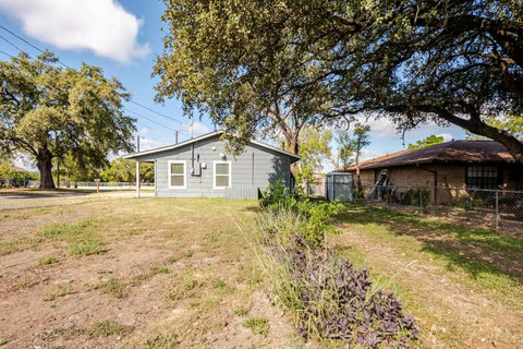 Side yard with picnic tables