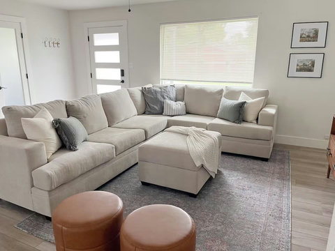 Cozy sectional with leather poufs