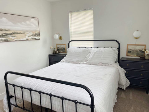 Queen bedroom with landscape art