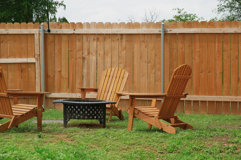 Adirondack chairs around the fire pit