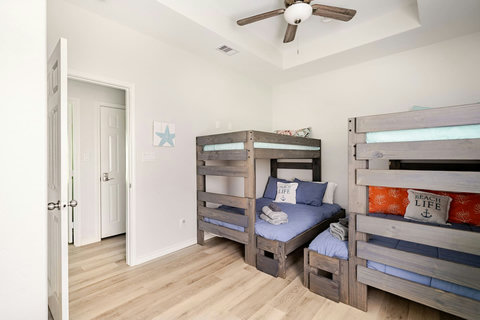 Bunk room with two twin-over-queen bunks