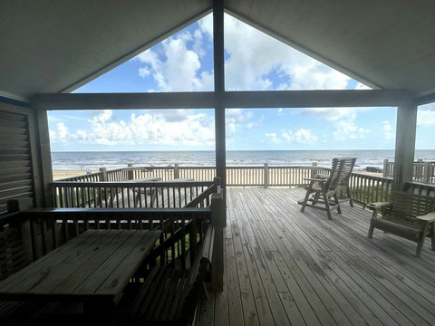 Covered deck with a view of the water