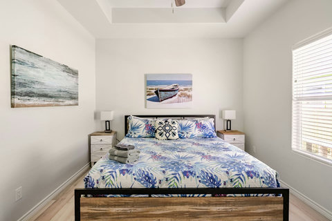 Second king bed with coastal art