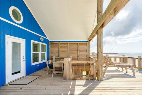 Covered deck with dining and loungers