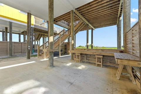 Outdoor bar seating under the house