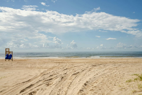 Wide, sandy beach in front of the house
