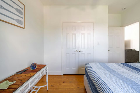 Bedroom with a bench and closet