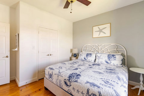 King bed with coastal bedding