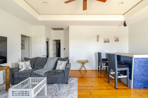 Second living area with sofas and bar seating