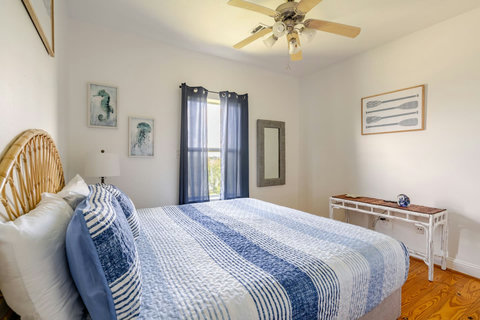 Bedroom with oar art and plenty of light