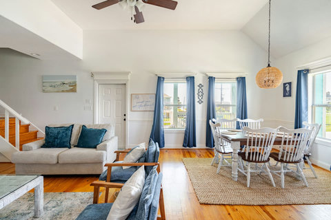 Living room with the dining table by the windows