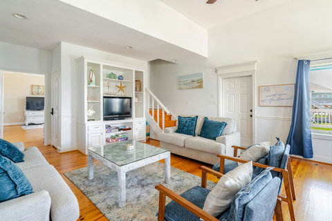 Living room with built-ins and a smart TV