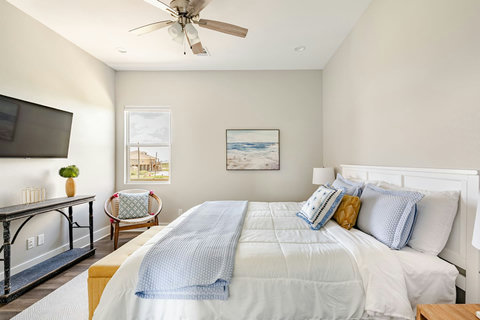 King bed with soft blue bedding