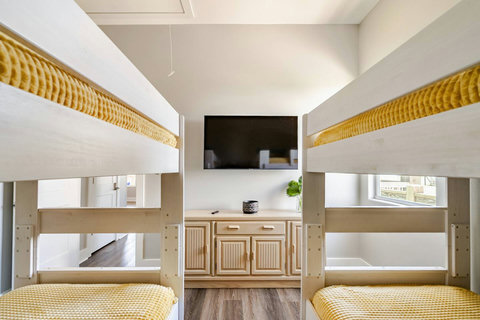 Bunk room with a TV