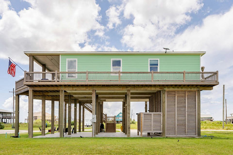 Wide covered deck along the house