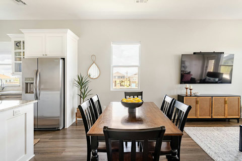 Dining table for six beside the living room