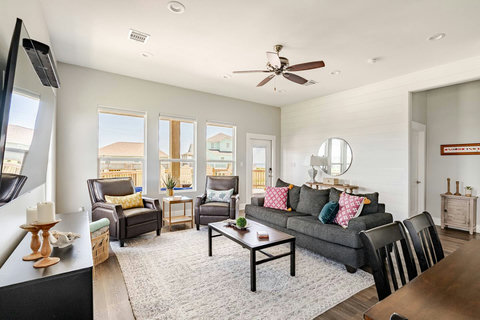 Bright living room with comfy seating and a smart TV
