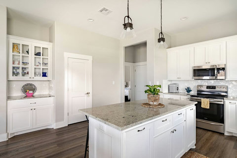 Granite island and stainless appliances