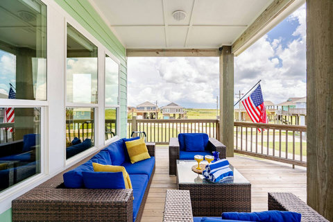 Outdoor lounge with flag and Gulf breeze