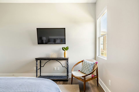TV and console in the king bedroom