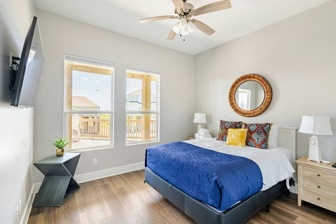 Queen bedroom with a smart TV