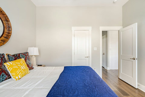 Queen bed by the window
