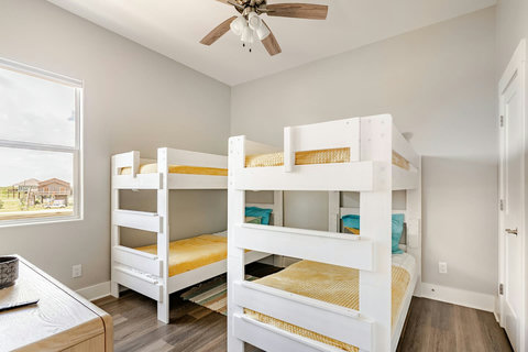 Bunks with sunny yellow bedding