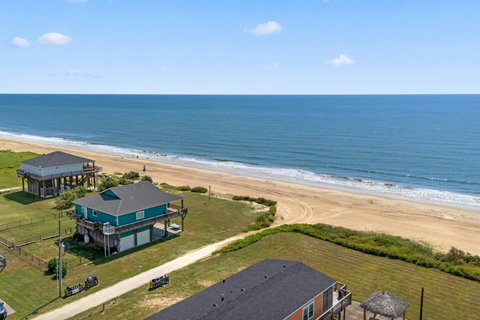 The house sits right where the sand begins