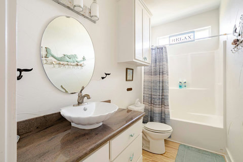 Hall bath with a tub and shower combo