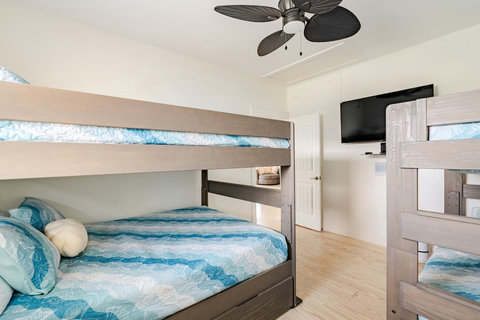 Bunk room with a TV for rainy afternoons