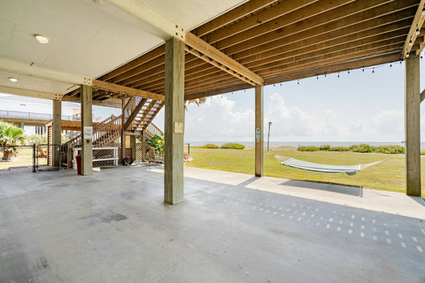 Shaded patio under the house with a hammock